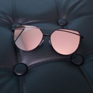 Rose gold sunglasses with black frame